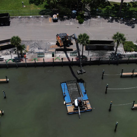 dredging boat in water in canal